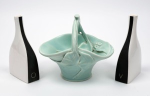 ELLIS pair of pottery vinegar and oil bottles, together with a green glazed gumleaf basket vase, (3 items), the bottles 18cm high