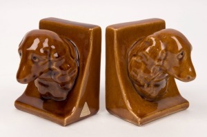 J.J. CERAMICS pair of brown glazed bookends, with original foil label, 11cm high