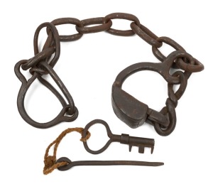 Convict leg irons with puzzle lock and keys, 19th century, 78m wide