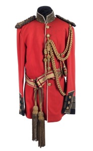 Officer's red dress tunic and accouterments, displayed on shop mannequin. 