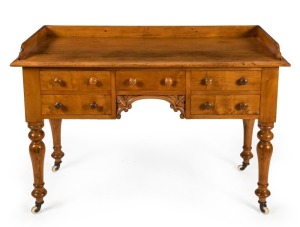 A huon pine lady's desk with gallery top, 19th century, 83cm high,120cm wide, 58cm deep