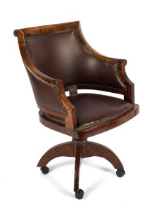 A fine antique Australian fiddleback blackwood and leather tub chair on revolving base, early 20th century, ​​​​​​​98cm high, 61cm across the arms