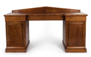A Colonial Australian cedar twin pedestal sideboard with Palladian back, handsomely selected cuts of cedar to the paneled doors, Tasmanian origin, circa 1835. Purported to have been made for "Chiswick", Ross, Tasmania. With accompanying Kent & Kent documentation. 107cm high, 188cm wide, 64cm deep
