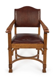 An important exhibition carver armchair, figured eucalypt, circa 1924, ink stamp to base "Australian Forest Commission, Victoria, Melbourne" and with "H. GOLDMAN" plaque to back of seat rail, 92cm high, 61cm across the arms