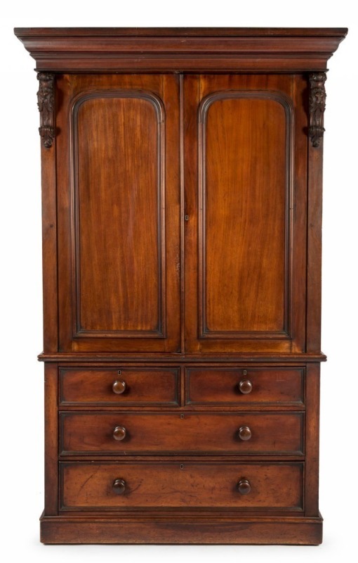 GEORGE THWAITES (attributed), impressive cedar gentleman's press on chest with finely carved facemask corbels, interior fitted with original slides in cedar, Melbourne origin, circa 1860s. Purported to have been part of the original furnishings for LABASS