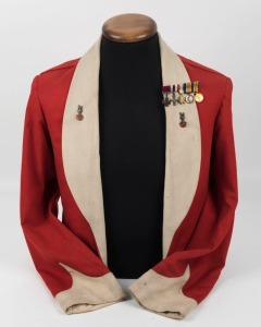 BRITISH MESS JACKET named to the Victoria Cross recipient Lt. Col. Harry Daniels V.C. The red wool jacket with white shawl collar and pointed cuffs, interior with tailor's label "Capt. H. Daniels V.C.". Accompanied by an original set of dress miniature me