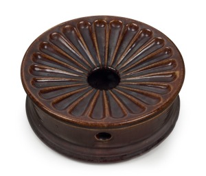 A colonial pottery spittoon with Rockingham glaze, 7.5cm high, 20.5cm diameter