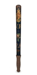 An antique truncheon with original blue painted finish, detailed with gilded highlights and Queen Victoria cypher "V. R.", 47cm long