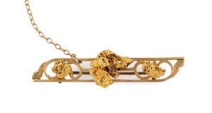 An antique Australian 15ct gold bar brooch, mounted with three natural gold nugget specimens, 19th century, 5cm wide, 7.5 grams total
