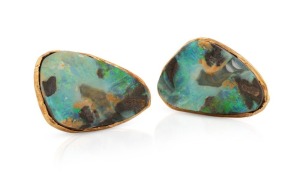 A spectacular pair of 18ct gold and solid Queensland boulder opal cufflinks, circa 1970, stamped "18c", 3cm wide, 25.7 grams total