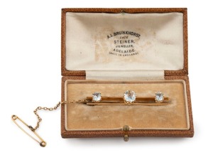 AUGUSTUS LUDWIG BRUNKHORST stunning antique Australian 18ct yellow gold brooch, set with three impressive aquamarines, 19th/20th century, stamped "A.L.B. 18ct", and housed in original plush fitted case branded "A.L. BRUNKHORST LATE STEINER JEWELLER, ADELAIDE", 5.1cm wide, 6.5 grams