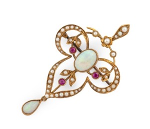 An antique 15ct yellow gold pendant/brooch, adorned with two fine polished solid opals, seed pearls and rubies, 19th/20th century, stamped "15ct", ​​​​​​​5cm high overall, 5 grams