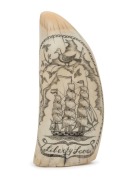 A scrimshaw whale's tooth with tallship portrait titled "LIBERTY LOVE", signed with scrimshander's monogram mark, ​​​​​​​13cm high