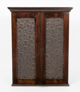 An unusual kauri pine cupboard with daisy-moulded panelled doors, conforming sides and chamfered detailing, circa 1900, 86cm high, 68cm wide, 29cm deep