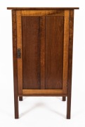 An Australian fiddleback blackwood single door cupboard with all-round figuring, circa 1920, 105cm high, 61cm wide, 55.5cm deep