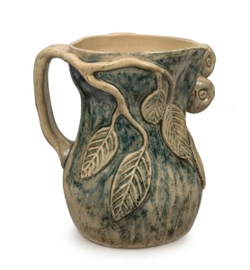 MERRIC BOYD impressive pottery jug adorned with applied pears, leaves, and branch handle, plus hand-painted finish. Incised "Merric Boyd, 1936" 23cm high, 21cm wide