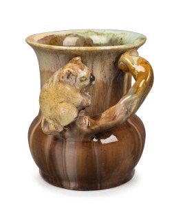 REMUED brown and cream glazed pottery vase with applied koala and branch handle, incised "Remued, 194/4", 11cm high