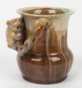 REMUED brown and cream glazed pottery vase with applied koala and branch handle, incised "Remued, 194/4", 11cm high - 3