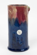 REMUED pottery cylindrical vase with applied gumnuts, branch handle and leaf, glazed in pink, blue and green, incised "Remued, Hand Made, 145/6M", 17cm high - 3