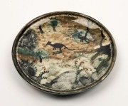 ARTHUR MERRIC BOYD and NEIL DOUGLAS pottery dish with hand-painted scene of two kangaroos&nbsp;in landscape adorned with grasstrees and flowers, incised "A. M. B. Neil Douglas", with Primrose Pottery Shop ink stamp, 18cm diameter - 2