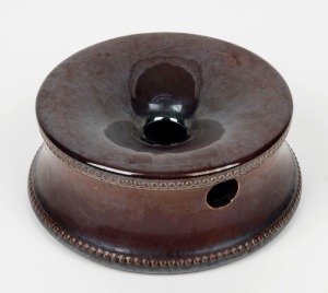 A colonial pottery spittoon with Rockingham glaze and pearled border, 6.5cm high, 16.5cm diameter