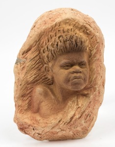 WILLIAM RICKETTS pottery wall plaque of an Aboriginal boy, incised "Wm. Ricketts", with additional pencil inscription (illegible). Together with "A Living Voice Of The Living Bush" 1965 booklet with signed dedication by Ricketts, a copy of White Fella Dreaming and a brochure from the William Ricketts sanctuary, (4 items). The plaque 21cm high