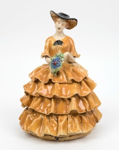 MARGUERITE MAHOOD pottery statue of a lady in a crinoline dress, incised "Marguerite Mahood", 23cm high