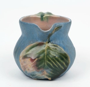 PHILIPPA JAMES pottery jug with applied gumnuts and juvenile gum leaf, glazed in blue and green with pink interior, incised "Philippa James" 7cm high, 9.5cm wide