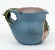 PHILIPPA JAMES pottery jug with applied gumnuts and juvenile gum leaf, glazed in blue and green with pink interior, incised "Philippa James" 7cm high, 9.5cm wide - 2