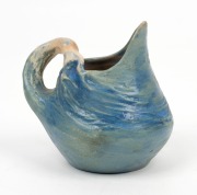 PHILIPPA JAMES pottery jug with applied wind swept branch handle, glazed in blue, incised "Philippa James" 9cm high, 9cm wide