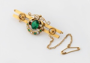 An antique 9ct yellow gold brooch with crescent decoration, set with green stones and seed pearls, 19th century, ​​​​​​​5.5cm wide, 5.4 grams total