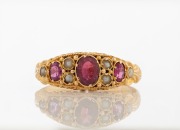 An antique 15ct yellow gold ring, set with garnets and seed pearls, 19th century, 1.9 grams&nbsp;