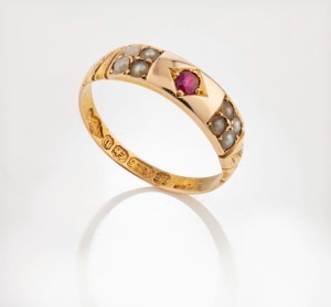 An antique 15ct yellow gold ring, set with a ruby and eight seed pearls, 19th century, ​​​​​​​2 grams