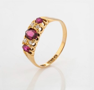 An antique 18ct yellow gold ring, set with three rubies interspersed with two pairs of white diamonds, early 20th century, 2.7 grams