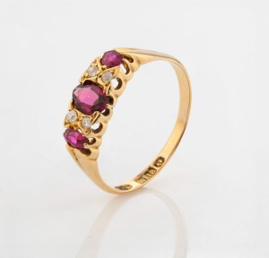 An antique 18ct yellow gold ring, set with three rubies interspersed with two pairs of white diamonds, early 20th century, ​​​​​​​2.7 grams