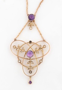 An antique 9ct rose gold negligee necklace, set with seed pearls and amethysts, circa 1910, the pendant 6cm high and 3cm wide, the chain 39cm long