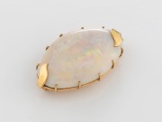A solid Coober&nbsp;Pedy&nbsp;white opal brooch, set in 9ct yellow gold with leaf decoration, stamped "9ct", ​​​​​​​5cm wide