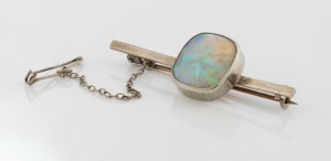 An antique solid opal brooch, set in silver, 19th/20th century, 5.3cm wide