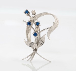 WILLIAM DRUMMOND & Co. of Melbourne 18ct white gold floral brooch, set with three white diamonds and three blue sapphires, stamped "W18D", 4cm wide, 5.2 grams