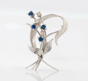 WILLIAM DRUMMOND & Co. of Melbourne 18ct white gold floral brooch, set with three white diamonds and three blue sapphires, stamped "W18D", ​​​​​​​4cm wide, 5.2 grams