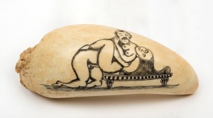 A scrimshaw whale's tooth adorned with erotic scene, 12cm high 