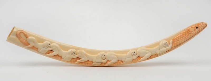 Walrus tusk carved in relief with serpent and figures, Alaskan origin, 42cm long