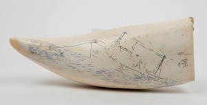 A vintage scrimshaw whale's tooth with whale boat scene, mid 20th century, ​​​​​​​20cm long