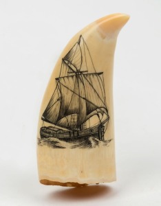 A scrimshaw whale's tooth adorned with sailing ship, 10cm high 