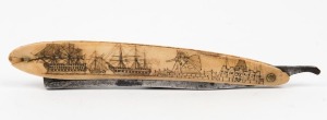 An antique whale bone cutthroat razor attractively adorned with scrimshaw port scene, 19th century, 16cm long when closed