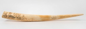 An antique walrus tusk with high relief carving of a tallship and mermaid sirens, early 20th century, ​​​​​​​75cm long