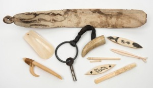 Three whalebone cotton bobbins with scrimshaw decoration, whalebone busk carved with lizard decoration, Pacific Islander whalebone fishing hook, whale tooth toggle on keychain, antique Chinese carved ivory cigarette holder, marine ivory shoehorn and bodki