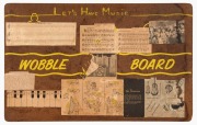 A pair of Masonite/ Dulux Paints branded Wobble Boards, "recommended by Rolf Harris" one with a number of music related labels fixed. 38cm wide, 61cm long. - 2