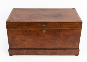 An antique Australian cedar flip-top trunk with string and barber pole cross-banding, moulded plinth base and recessed brass hardware, 19th century, 48.5cm high, 88cm wide, 48.5cm deep