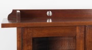 An Australian solid blackwood Arts & Crafts bookcase with pierced rail back, two bevelled glass doors, two lower open tiers and shaped feet, circa 1910, 146cm high, 98.5cm wide, 32cm deep - 2